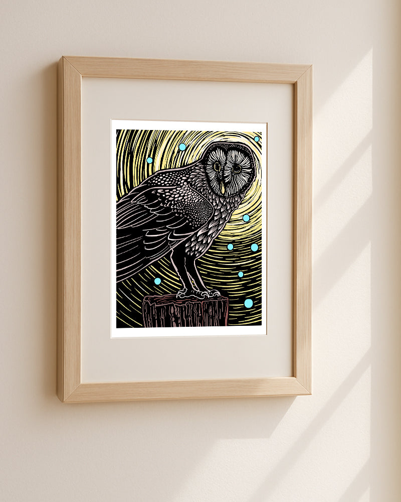 Framed artwork of an owl on a branch against a starry night sky.
